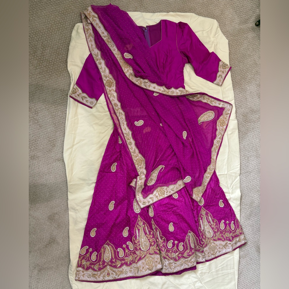 Vibrant Magenta silk lengha hand embroidered with Gold and bead Accents